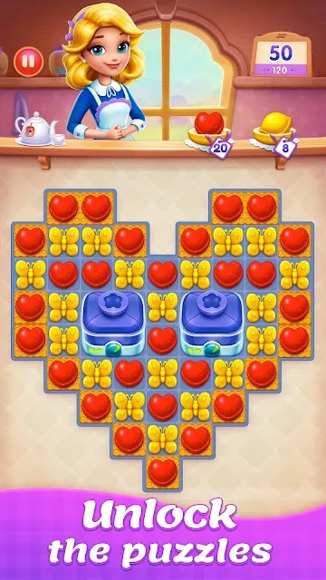 A heart-shaped board of red and yellow sweets with two locked tiles at its centre, fifty moves left